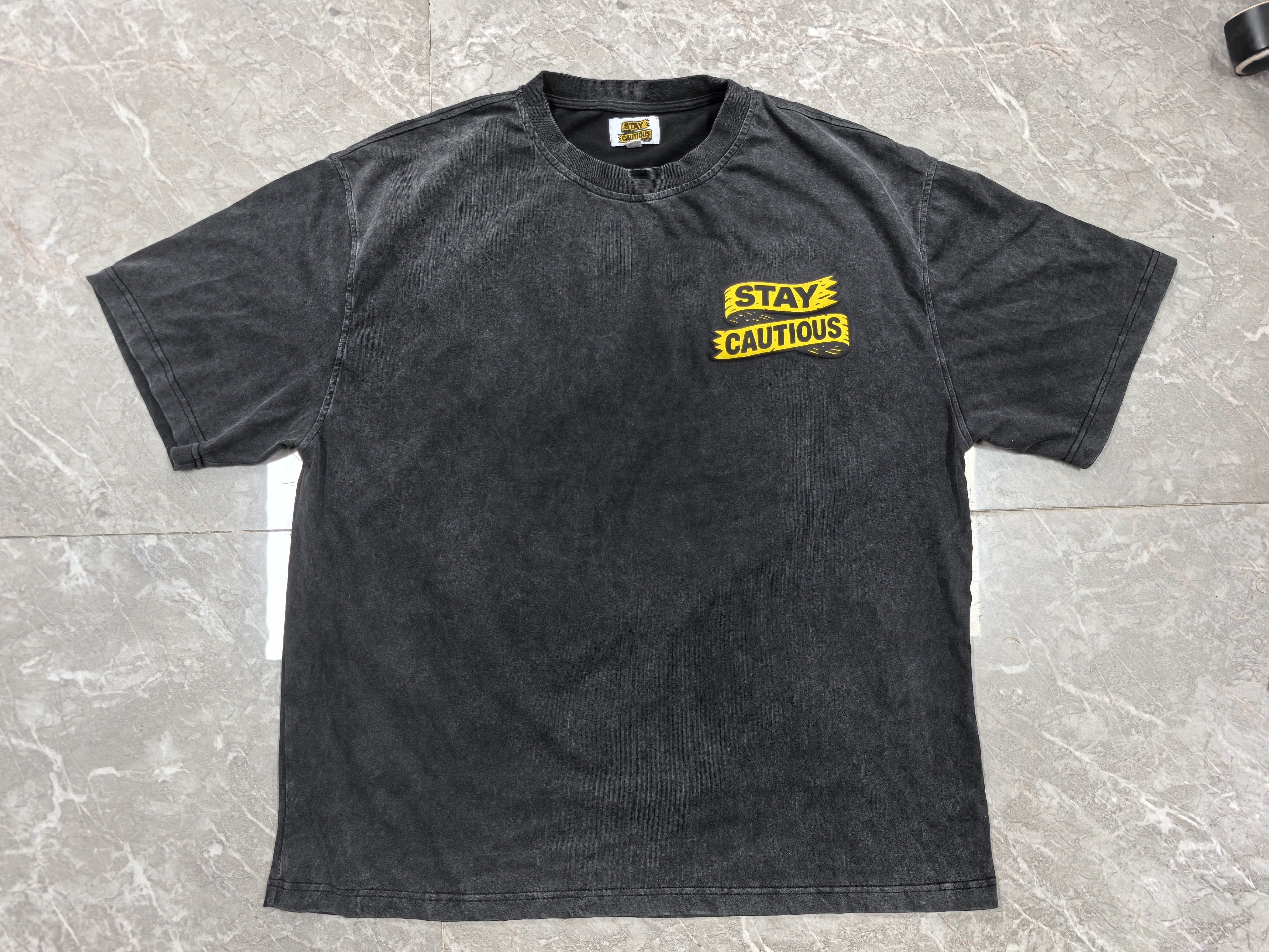 Stay Cautious (acid wash) Black Tee